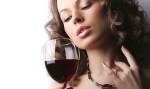 Portrait of beautiful woman with glass red wine